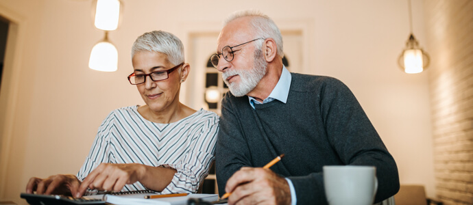 Elderly couple reviews bills