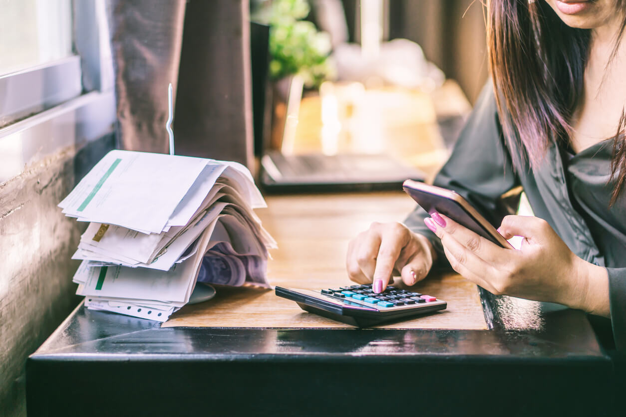 Woman calculating her debts