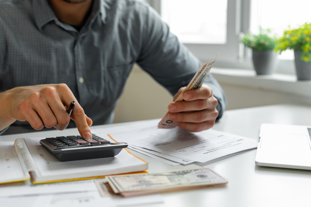 man calculating wages