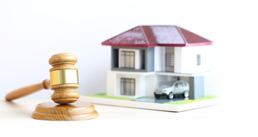 Model house with judge gavel