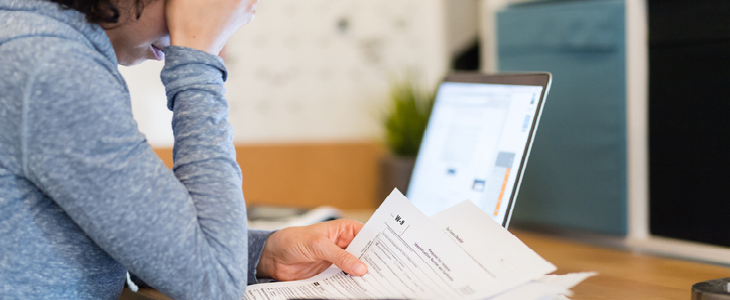 Woman going through debt collection documents