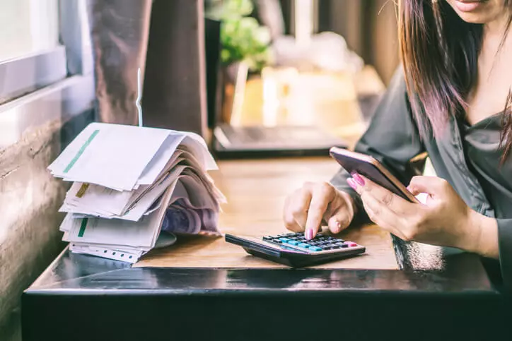 Woman calculating her debt