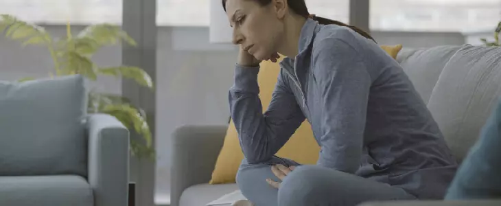 A woman in distress after being contacted by Linda Leong for debt